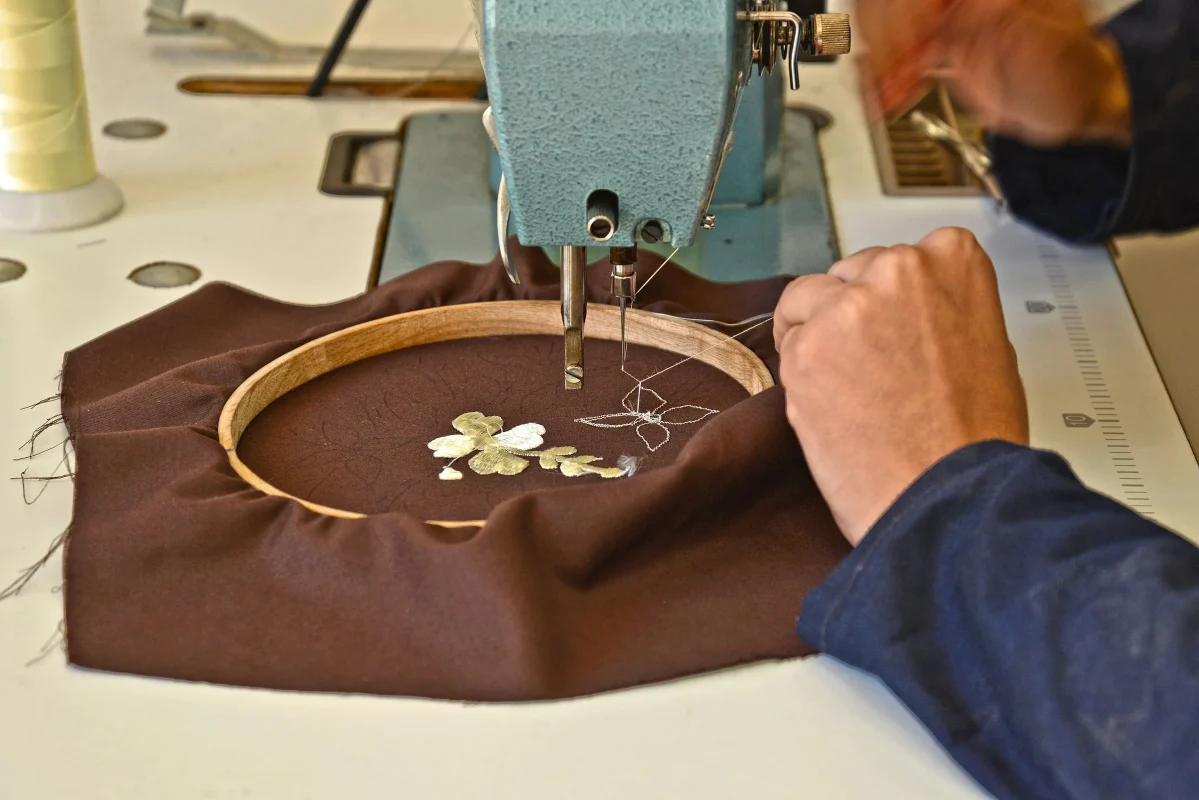 Embroidery machine applying a detailed design